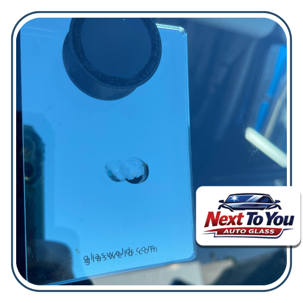 Mobile auto glass in Santa Ana CA technician replacing windshield at home