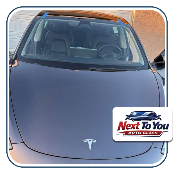 Technician doing windshield replacement in Los Angeles,CA at a customer’s driveway