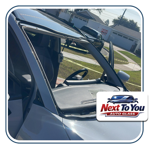 Mobile technician doing windshield replacement in Santa Ana, CA